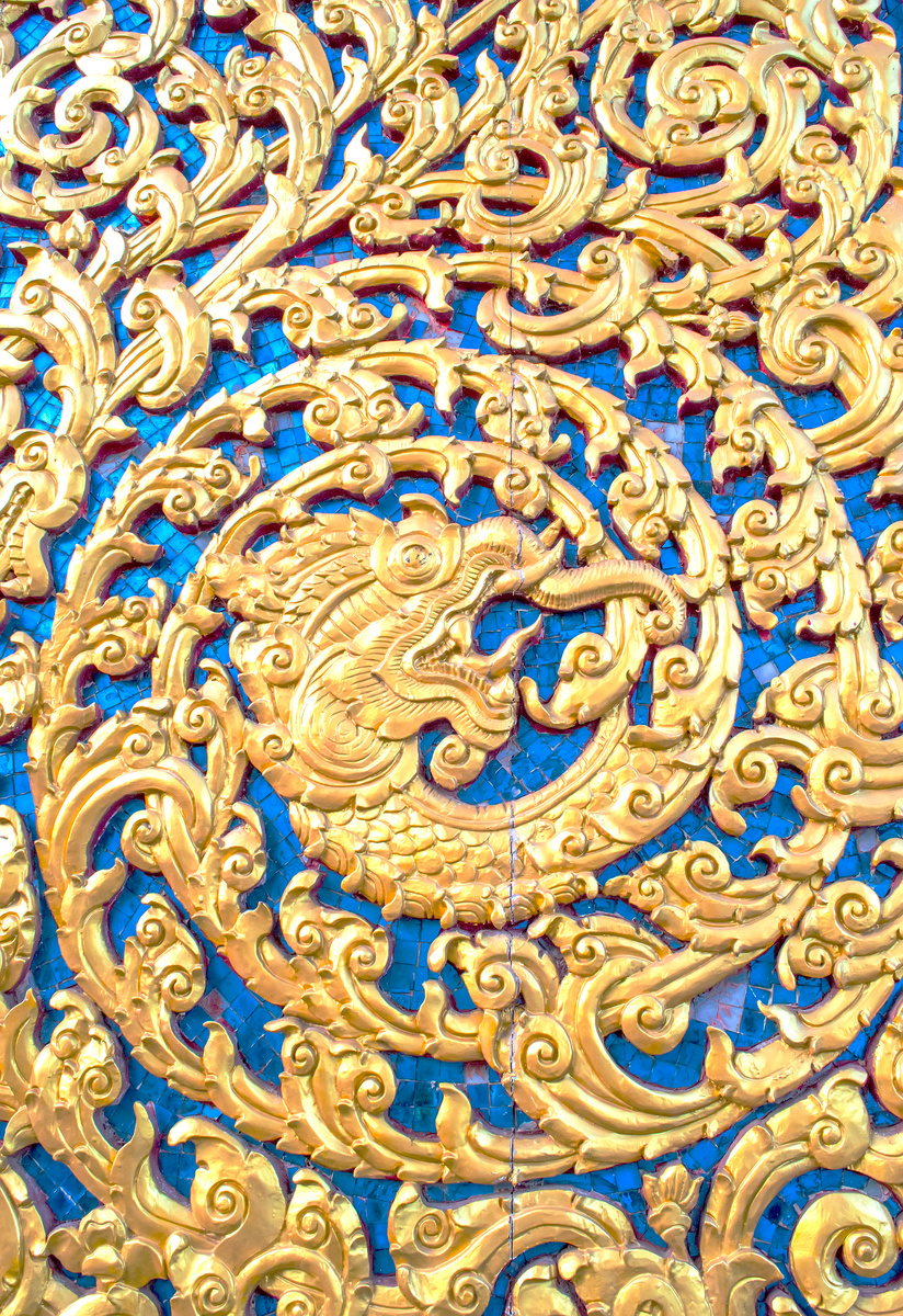 Carving gold naka art at  Wat Phra That Phanom,Thailand